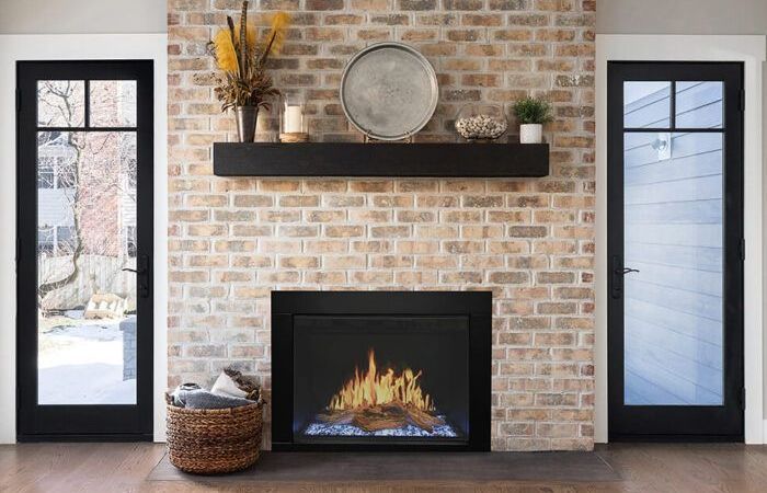 A living room with a fireplace and a couch.
