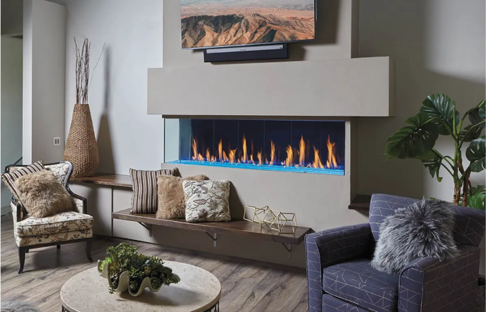 A living room with a fireplace , chairs , and a table.