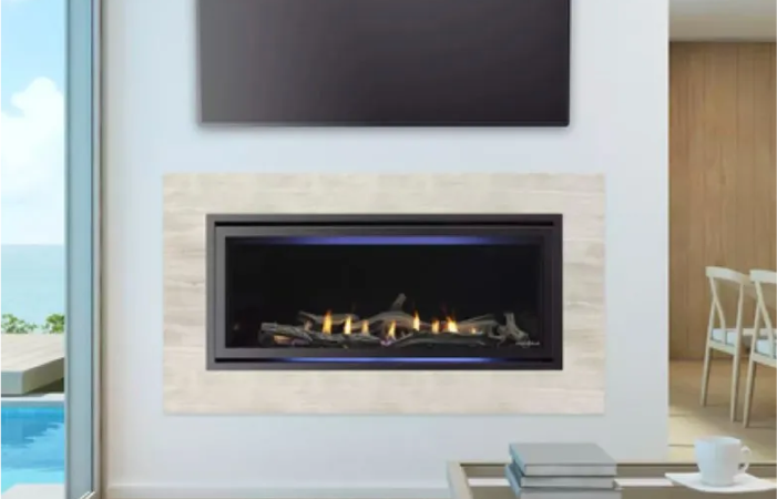 A fireplace with a flat screen tv above it in a living room.