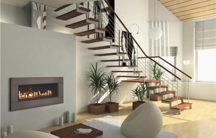 A living room with a staircase and a fireplace