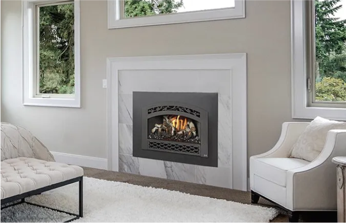 A living room with a fireplace and a couch and chair