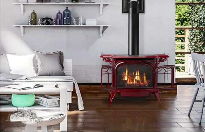 A living room with a red fireplace and a couch.