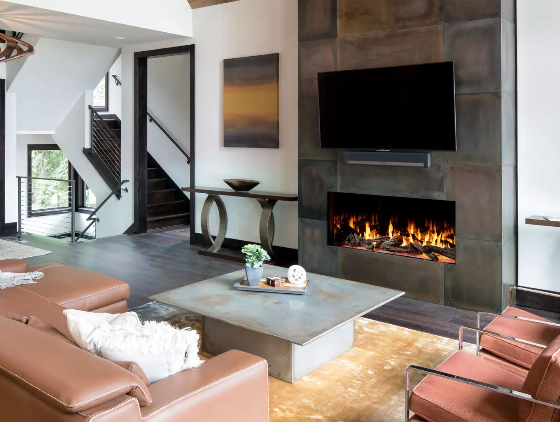 A living room with a fireplace and a flat screen tv.