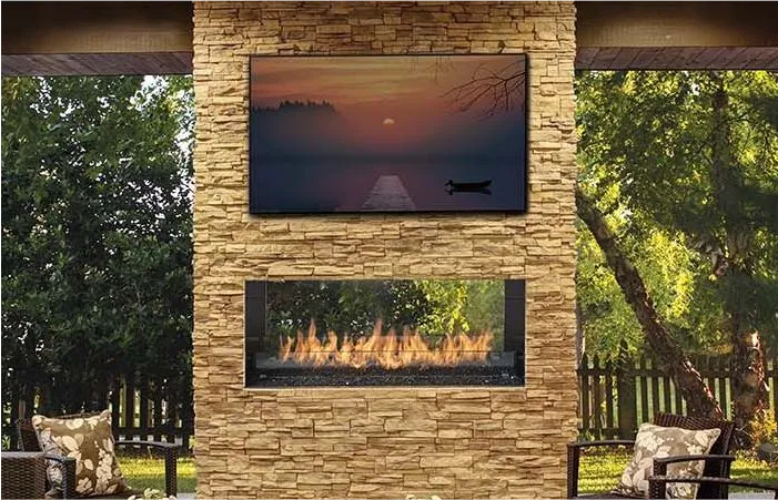 A fireplace with a flat screen tv above it.