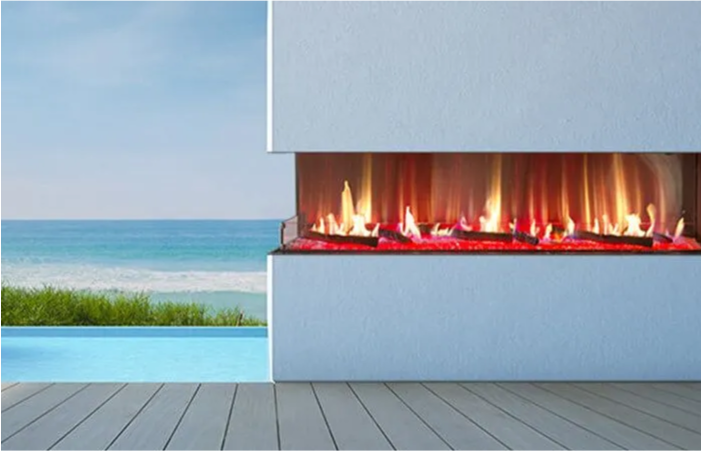 A fireplace with a view of the ocean in the background