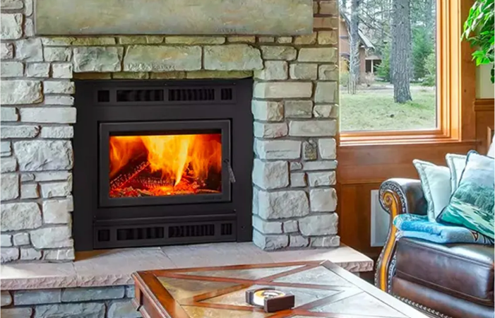 A living room with a fireplace and a coffee table.