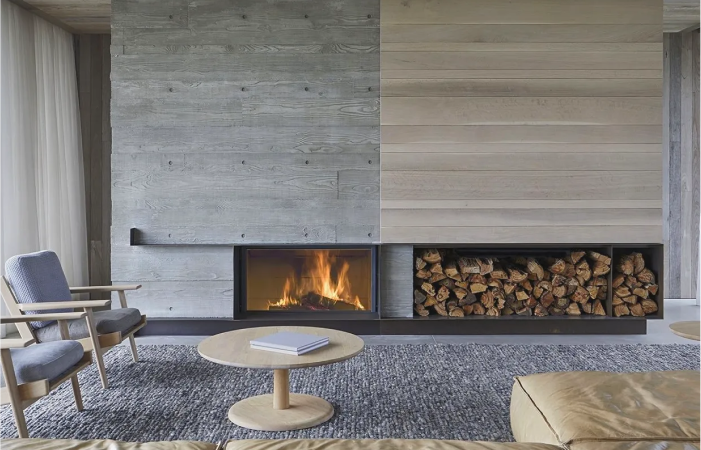 A living room with a fireplace and a coffee table