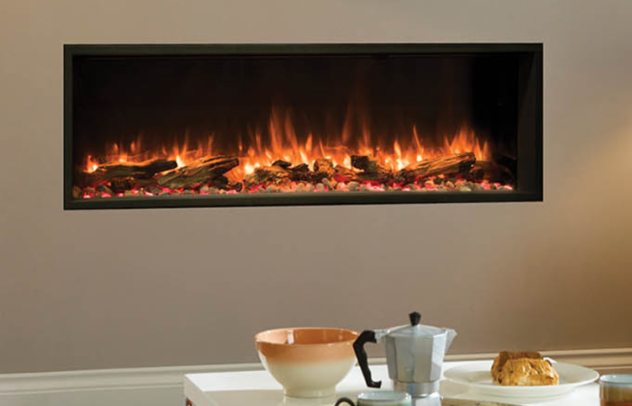 A living room with a fireplace and a table with a bowl of food on it.