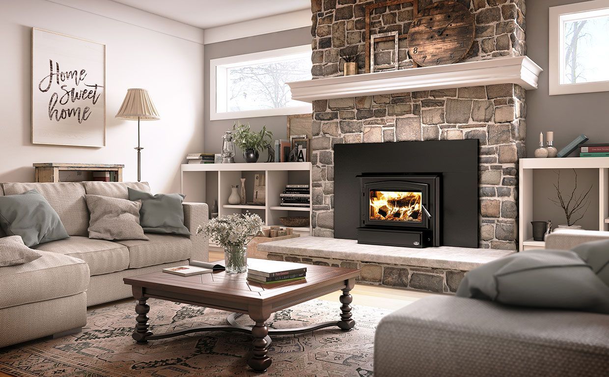 A living room with a fireplace and a television on the wall.