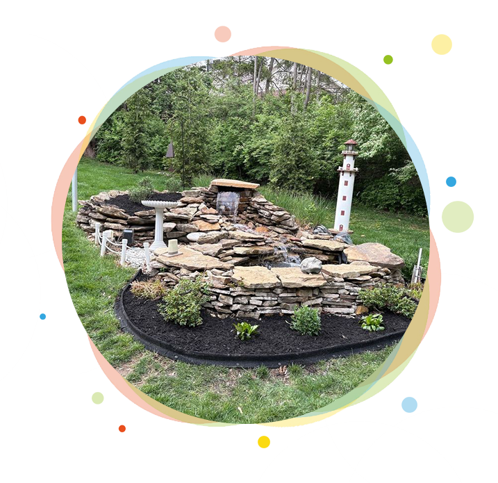 Landscaped rock waterfall with plants, lighthouse. Landscaped rock waterfall with plants, lighthouse.