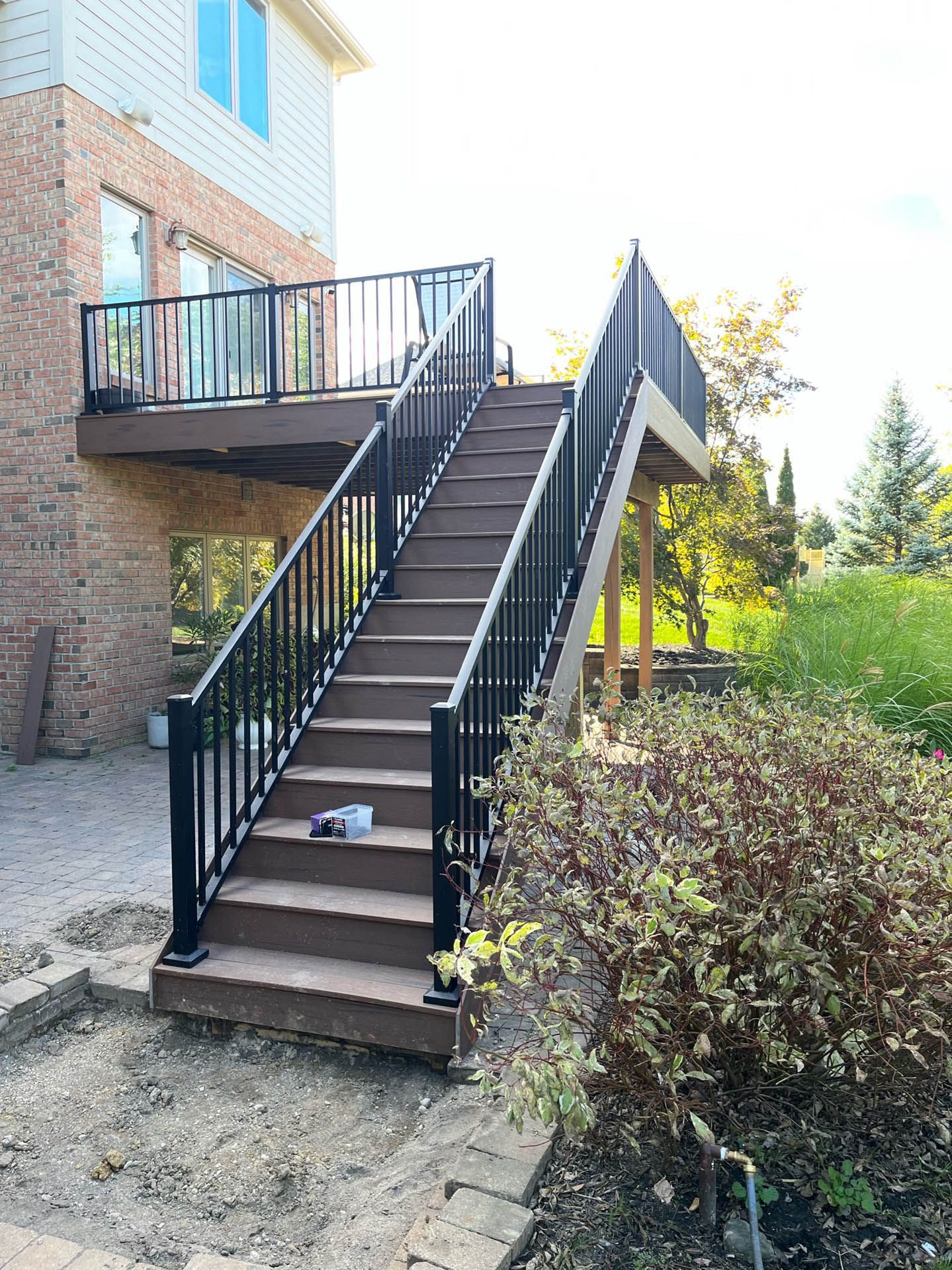 A wooden deck with stairs leading up to it.