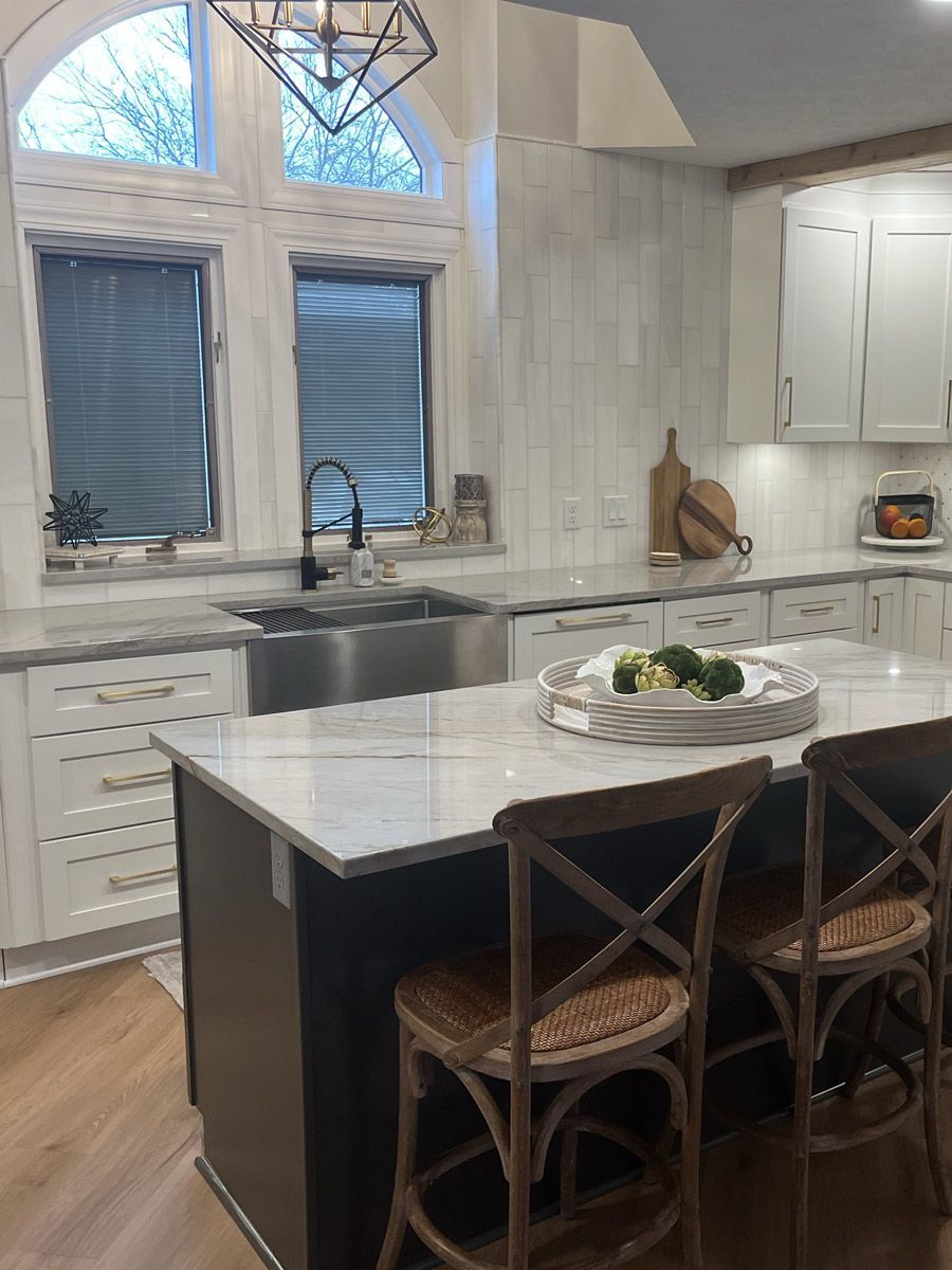 A kitchen with a large island and a sink