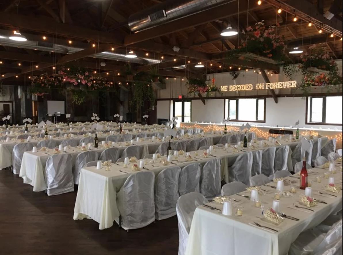 A large room with tables and chairs set up.