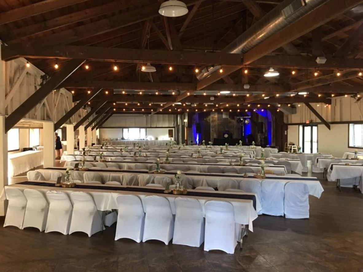 Tables and chairs set up for a wedding reception.