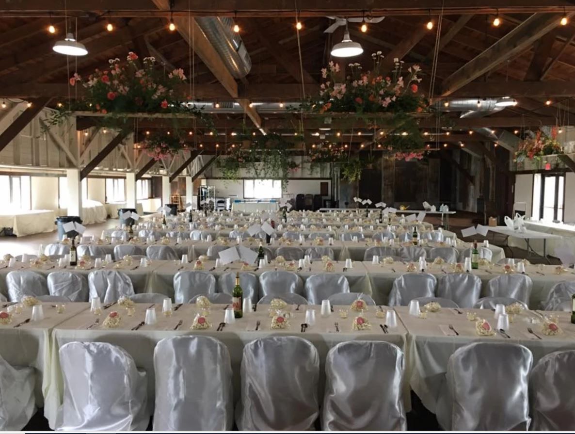 A large room with tables and chairs.