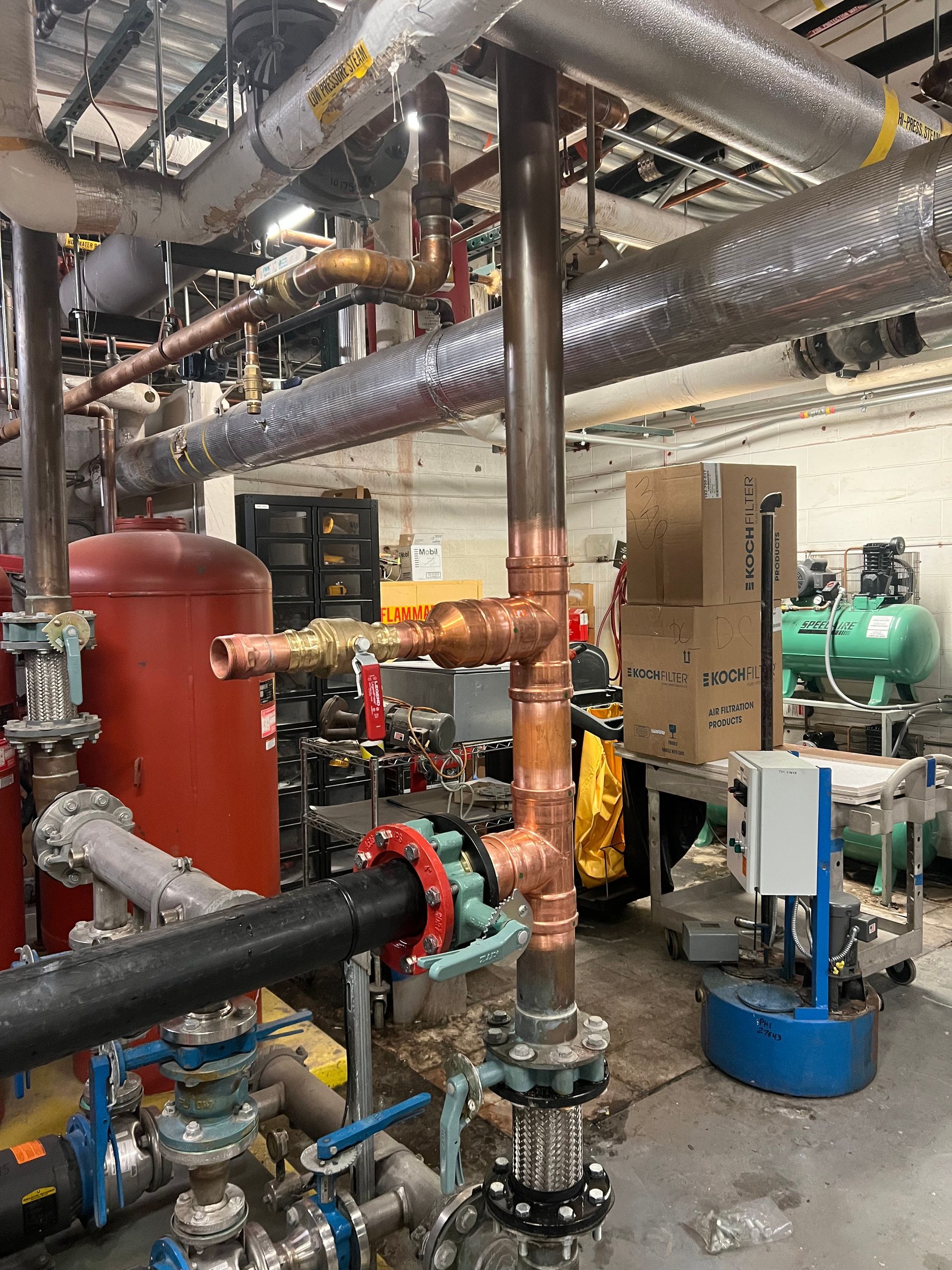 A warehouse filled with lots of pipes and valves.