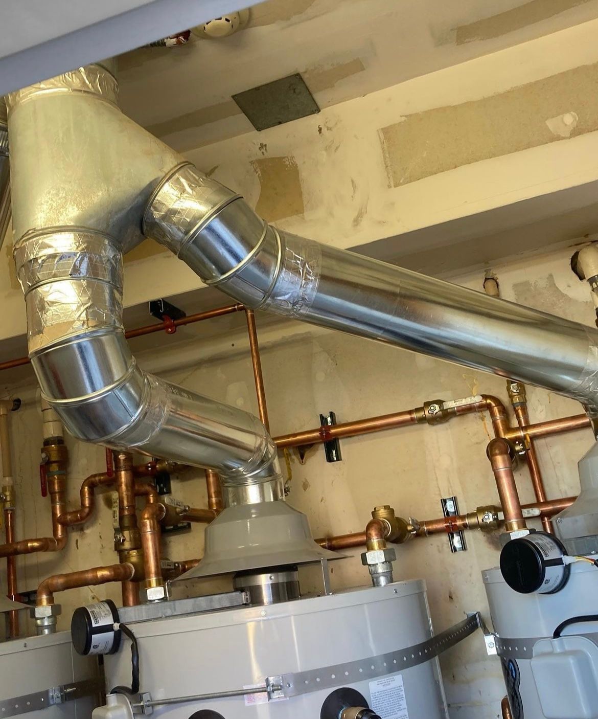 A room with a lot of pipes going through it