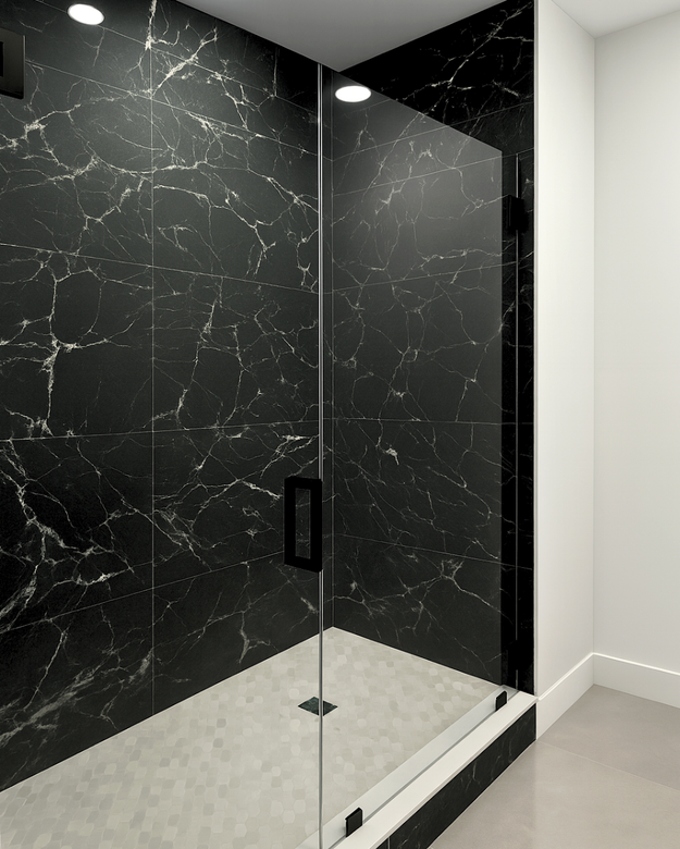 Shower with black marble tile walls, glass door, and white floor.