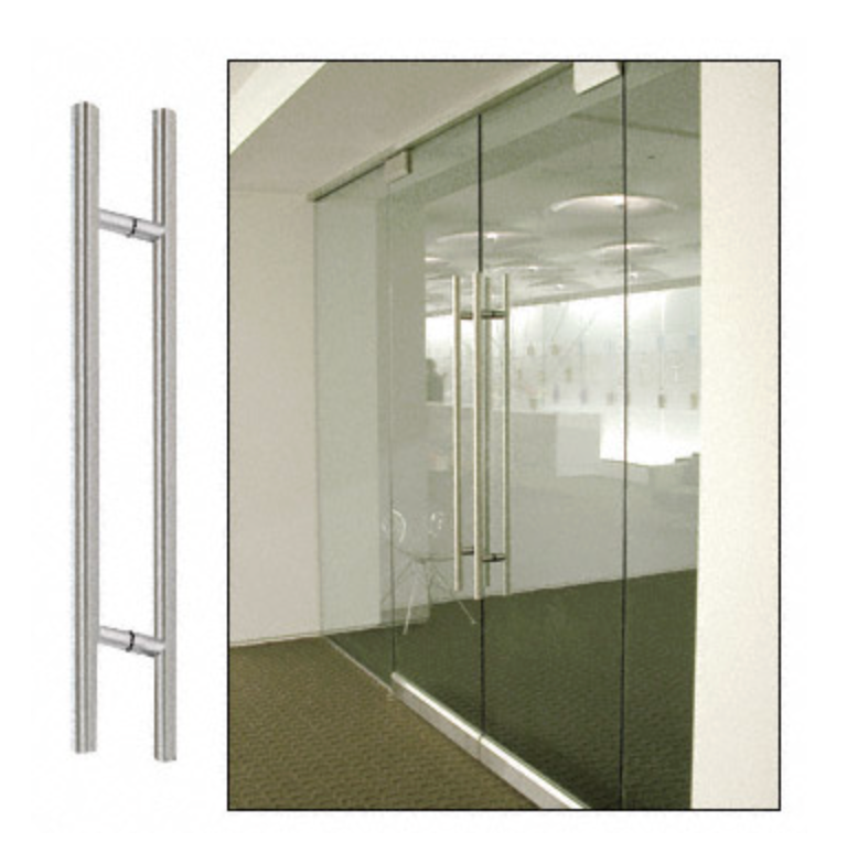 Stainless steel door pulls on glass door in office setting.