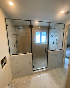 Custom Framed Shower Enclosure with Matte Black Hardware completed during a luxury bathroom renovation in Coral Gables.