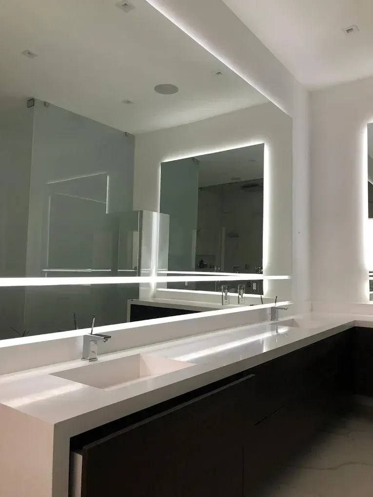 Custom LED Vanity Mirror Installation completed as part of a luxury condominium bathroom renovation in Downtown Miami.