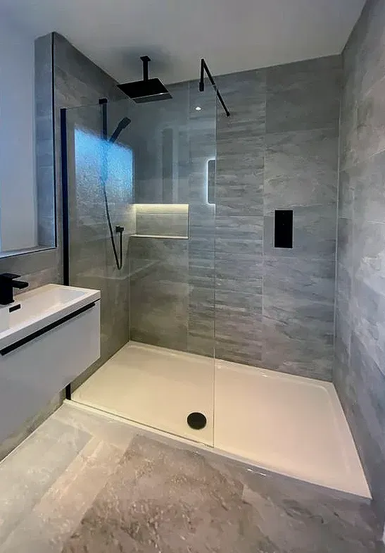 Custom Frameless Shower Glass Panel installed as part of a modern Miami Beach bathroom renovation.