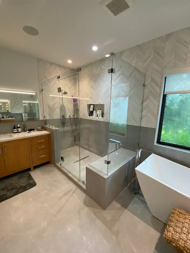 Custom Frameless Shower Enclosure fabricated and installed for a residential bathroom renovation in Palmetto Bay.