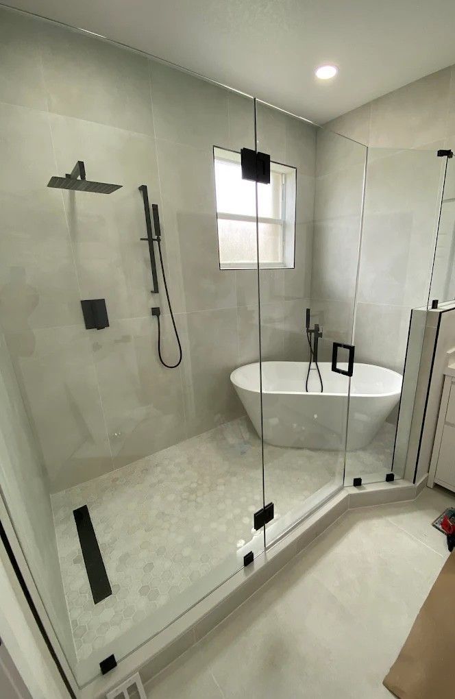 Custom Neo-Angle Frameless Shower Enclosure fabricated and installed for a Pinecrest custom home.