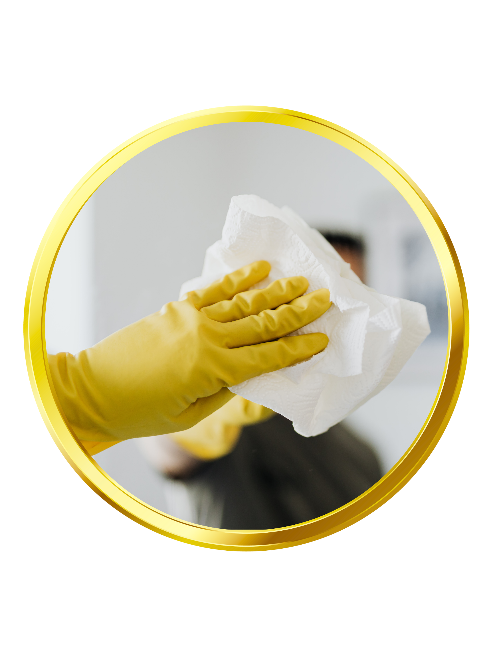 Hand in yellow glove holding white cleaning cloth; cleaning surface.