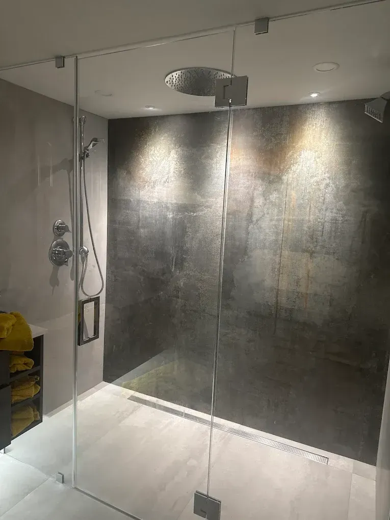 Frameless walk-in shower enclosure with premium hardware installed for a bathroom remodel in West Miami.