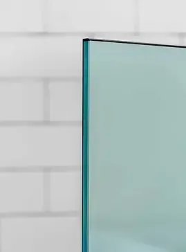 Glass panel against white brick wall.