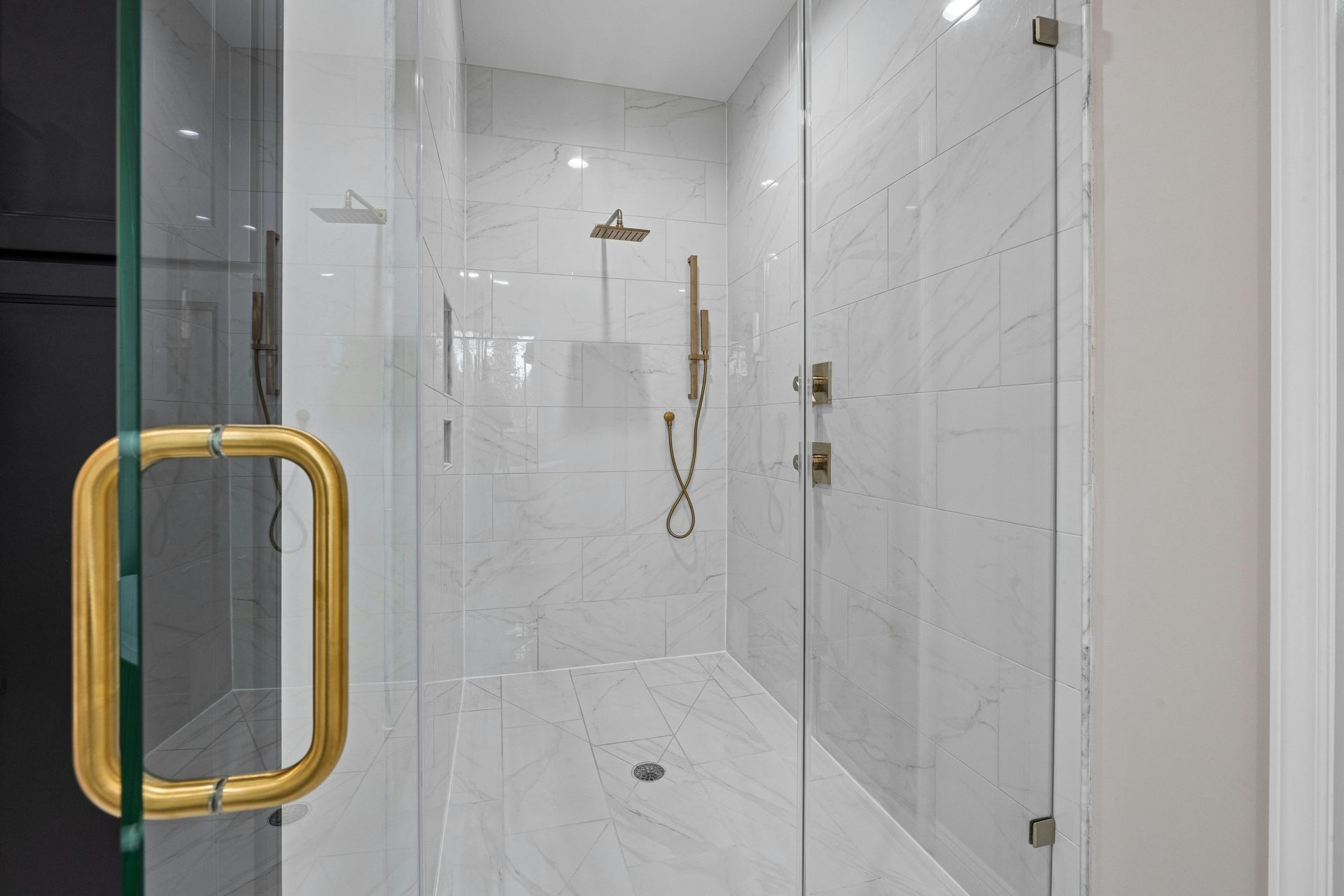 Gold Frameless shower hardware in Miami, Florida