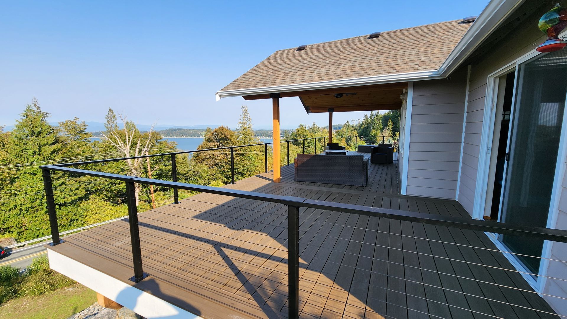 A house with a large deck with a view of the ocean
