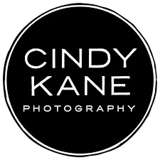 Cindy Kane Photography logo in a black circle with white text