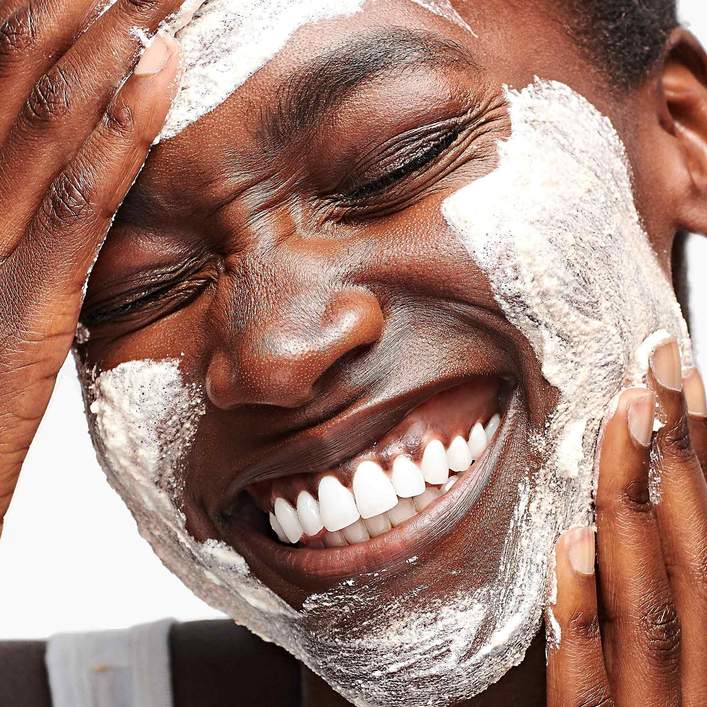 Woman applying Dermalogica daily microfoliant