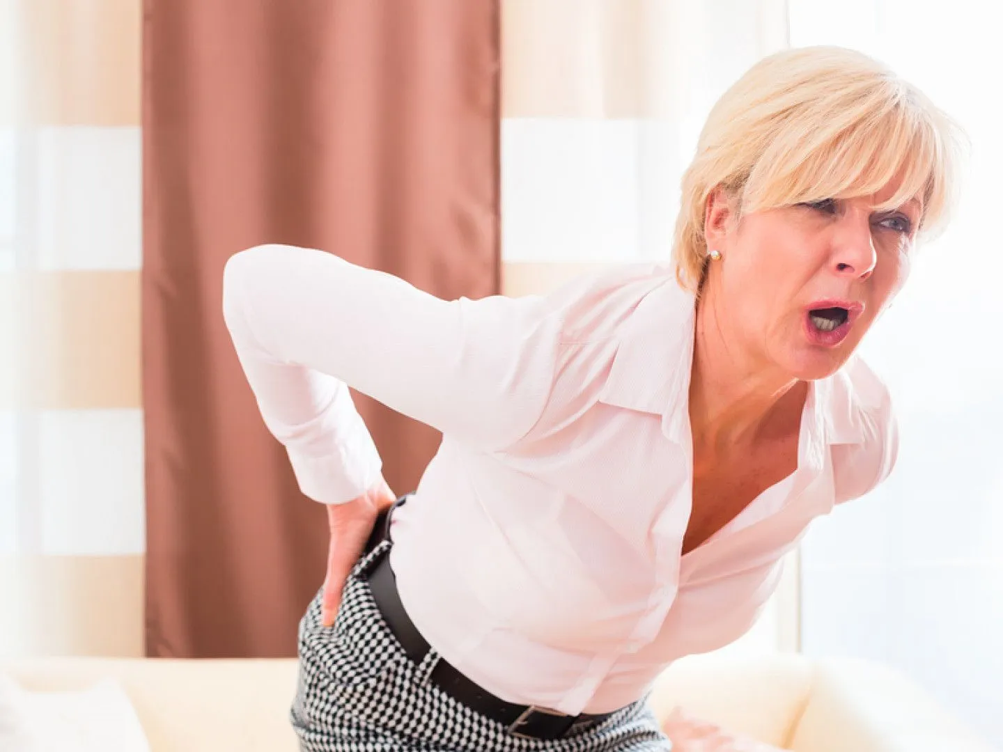 Woman struggling with sciatica