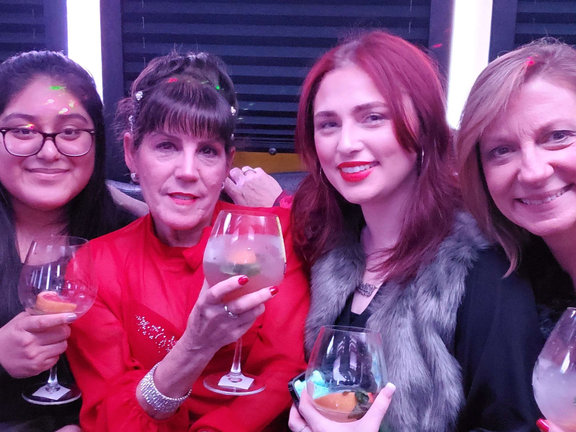 Our staffs holding glass of wine