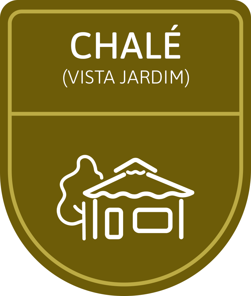 Um logotipo para um chalé com uma montanha ao fundo.