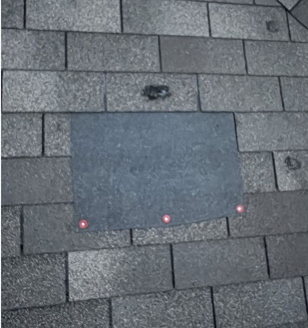 A gray brick floor with a square in the middle