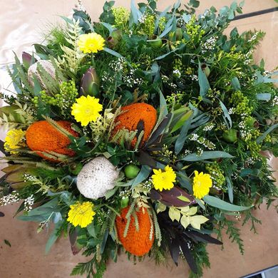 A Vase Filled With White and Green Flowers is on a Table — The Flower Station Townsville In Kirwan, QLD
