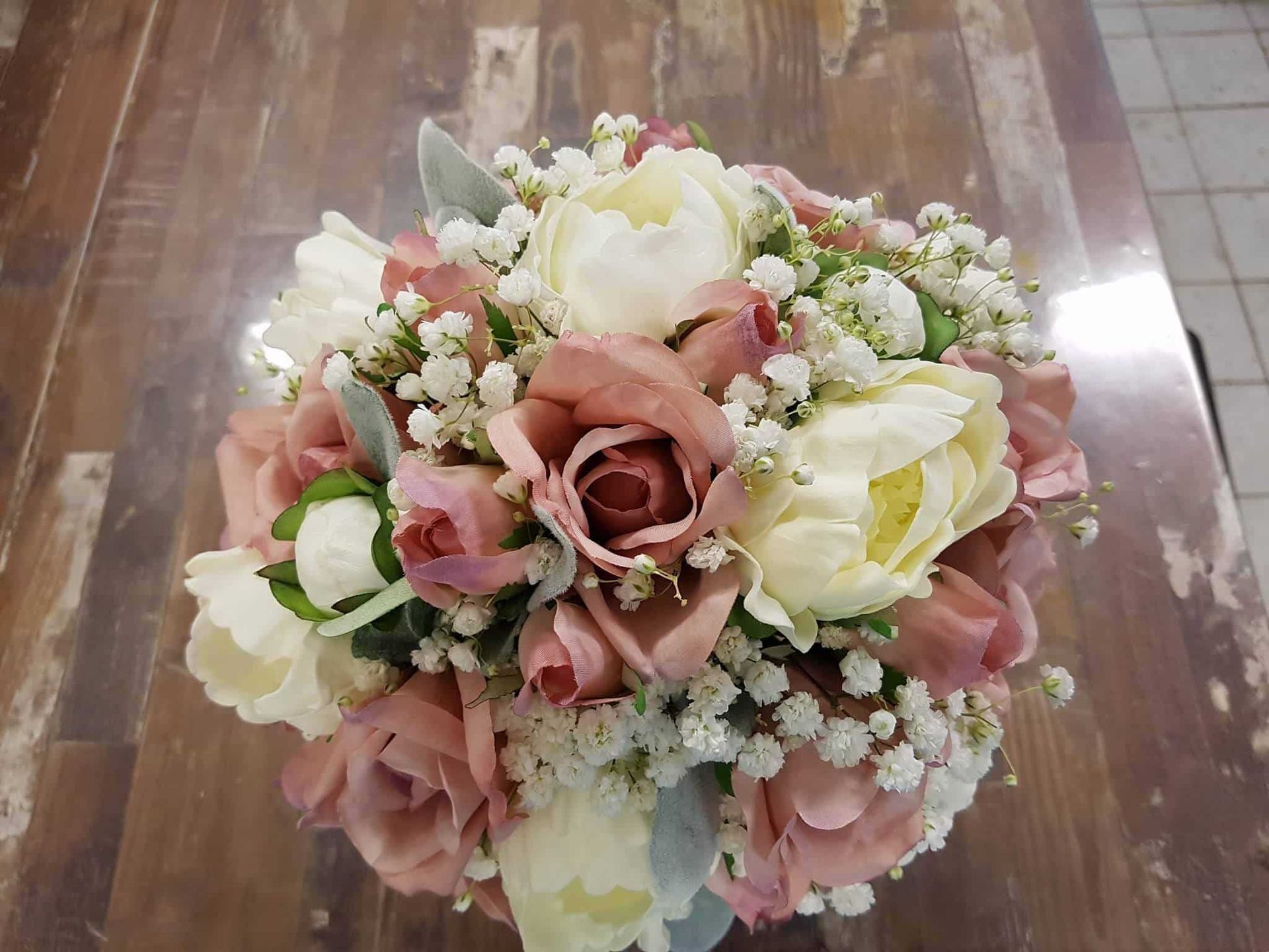 A Bunch of Vases Filled With Flowers Are Sitting on a Table — The Flower Station Townsville In Kirwan, QLD