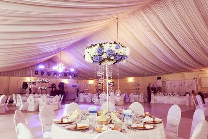 A Large Room With Tables and Chairs Set Up for a Wedding Reception — The Flower Station Townsville In 
Kirwan, QLD