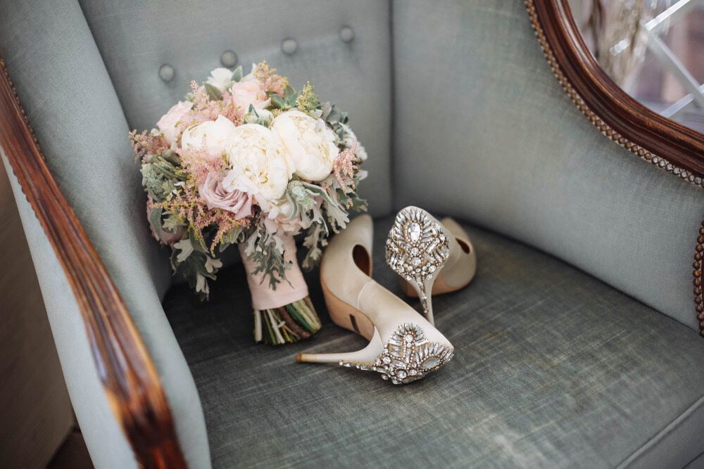 A Bouquet of Flowers and a Pair of Wedding Shoes Are Sitting on a Chair — The Flower Station Townsville In Kirwan, QLD A Bouquet of Flowers and a Pair of Wedding Shoes Are Sitting on a Chair — The Flower Station Townsville In Kirwan, QLD