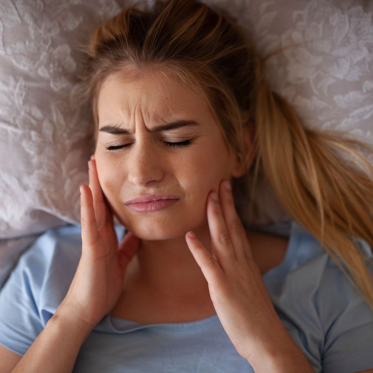 A woman with tooth pain