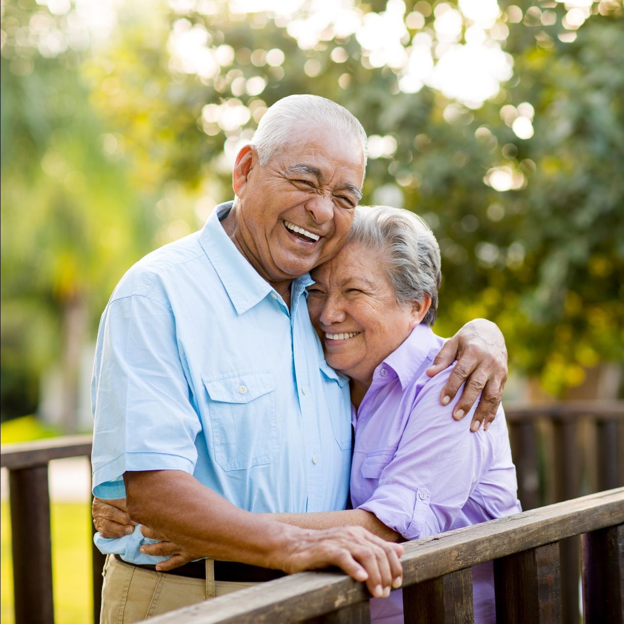 An elderly couple smiling