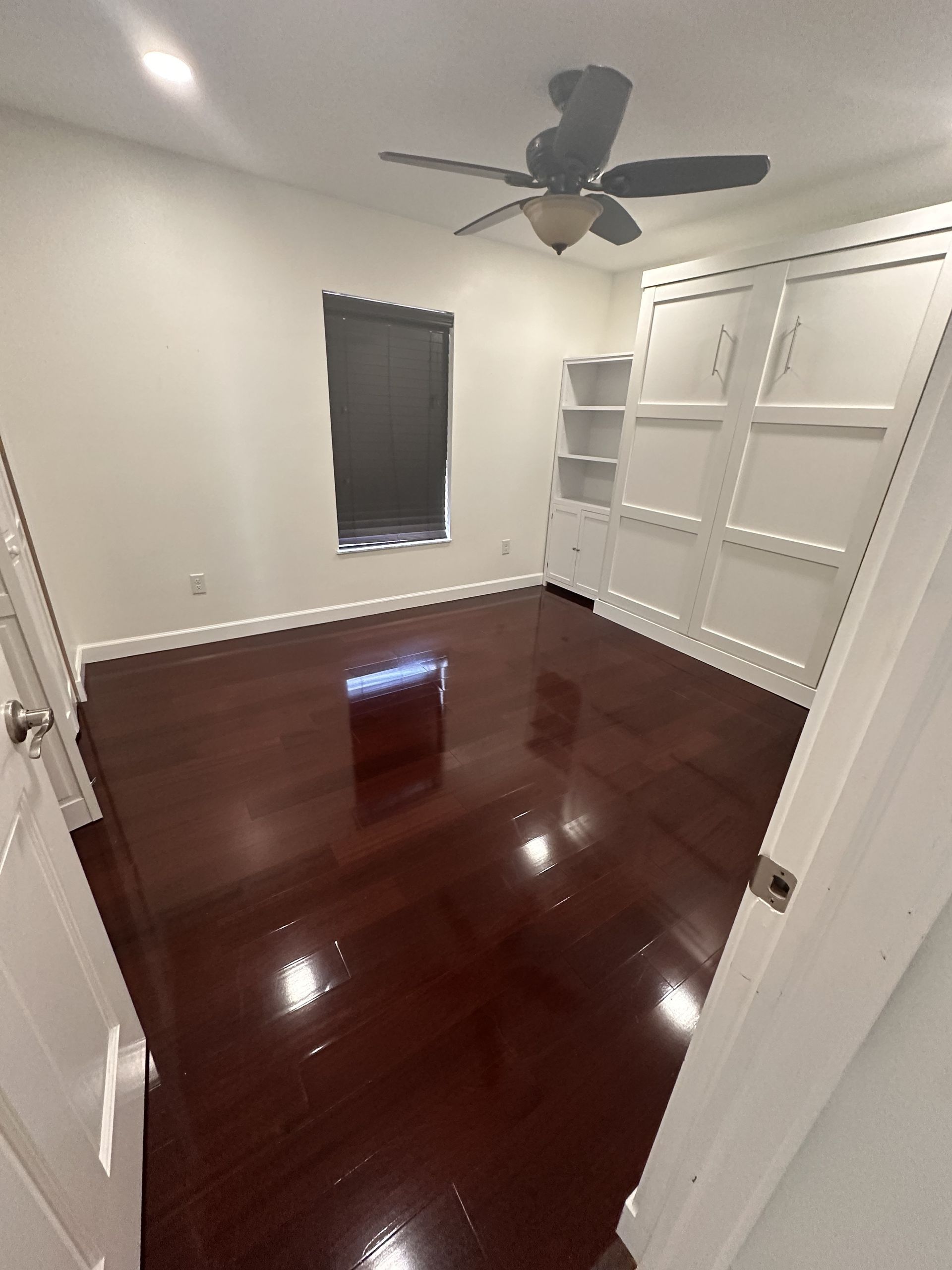 A vacuum cleaner is sitting on the floor in a room under construction.