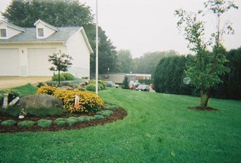 Lush Green Yard with White House | Middleton, WI | Kalscheur Landscaping, Inc.