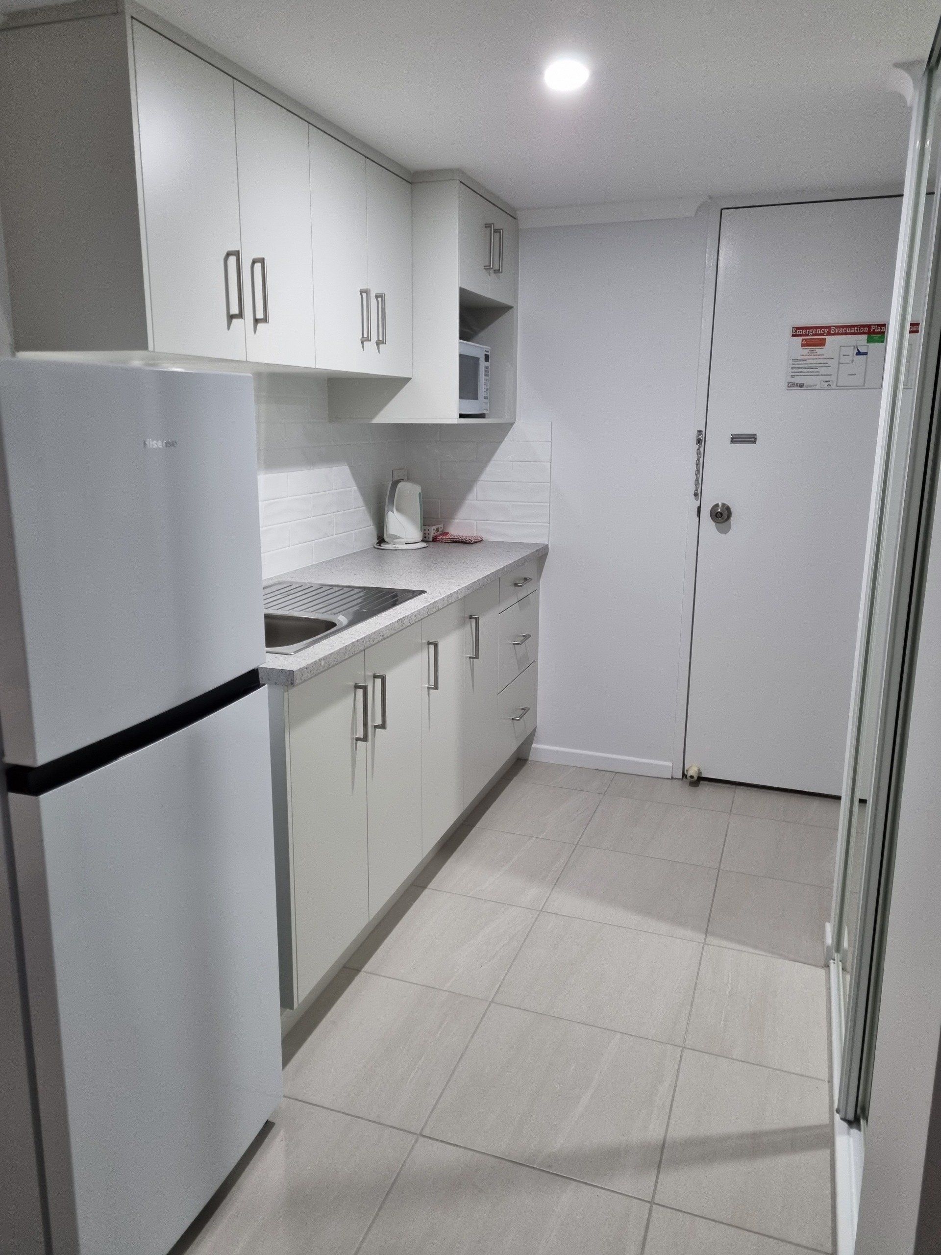 twin studio apartment kitchen