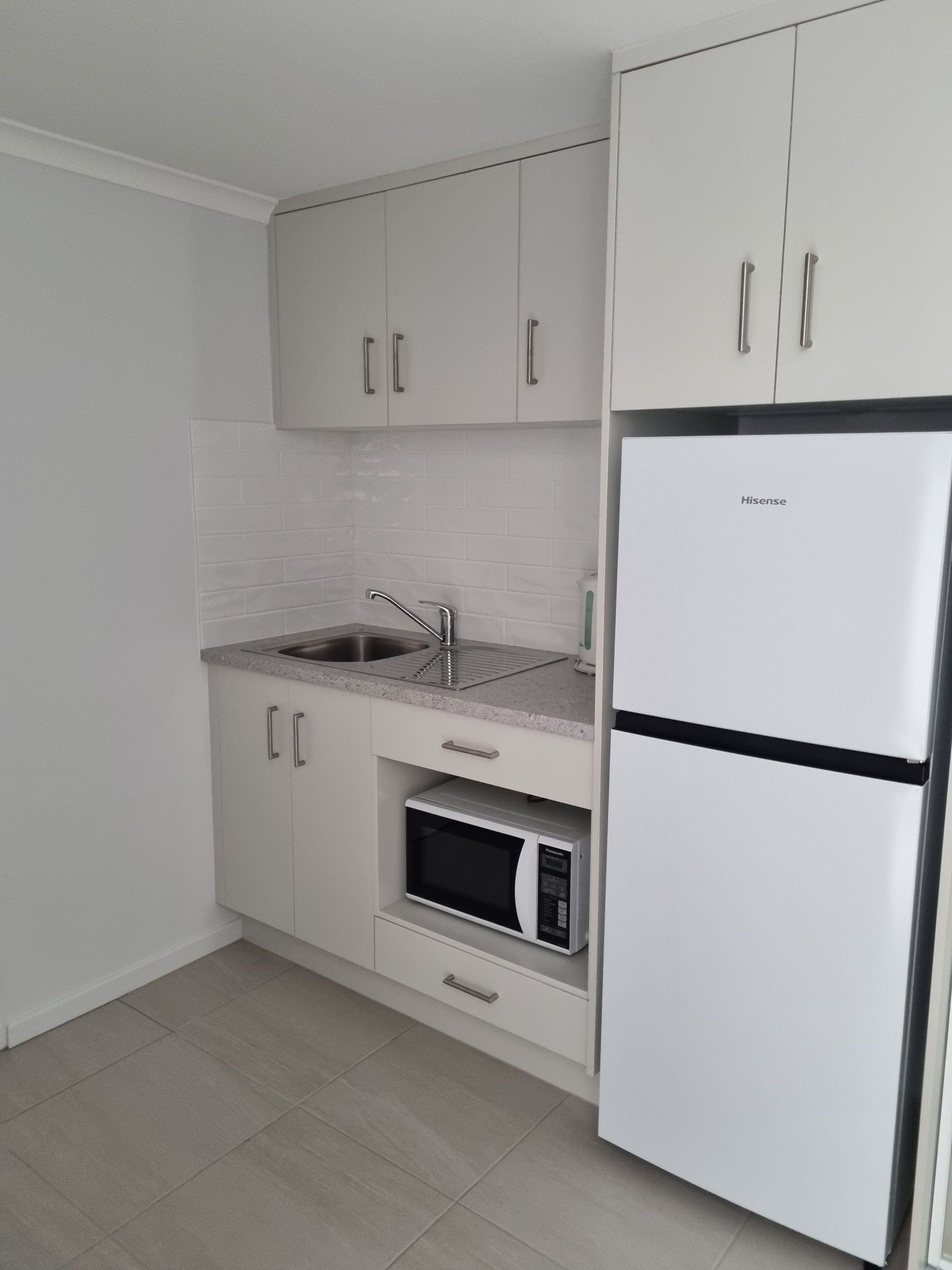 twin studio apartment kitchen