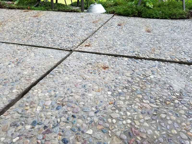 Concrete Sidewalk With Stones — Olin, IA — Sn’S Mudjacking